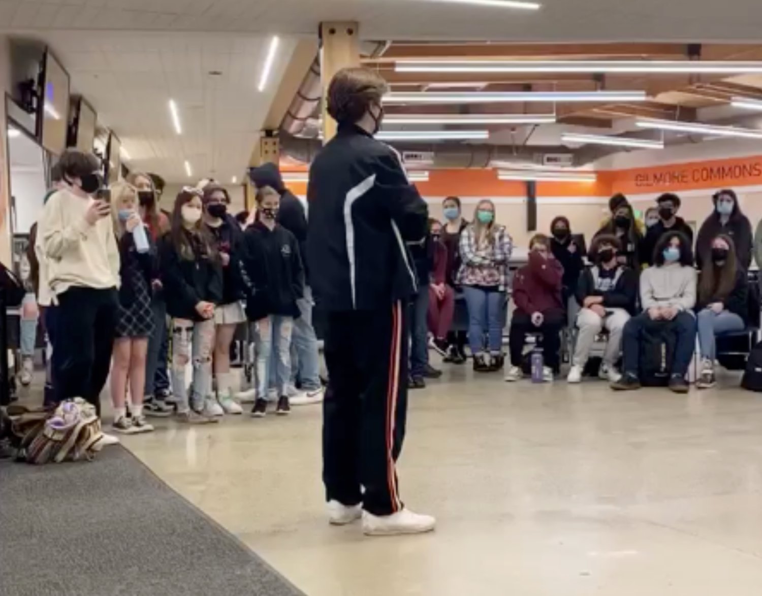 Students stand and sit in the Centralia High School commons during a protest on Wednesday in this image from a video of the event provided to The Chronicle.